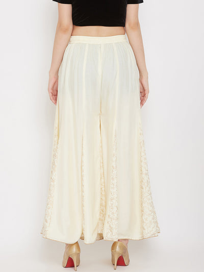 Cream printed rayon gharara with flared design and comfortable fit.