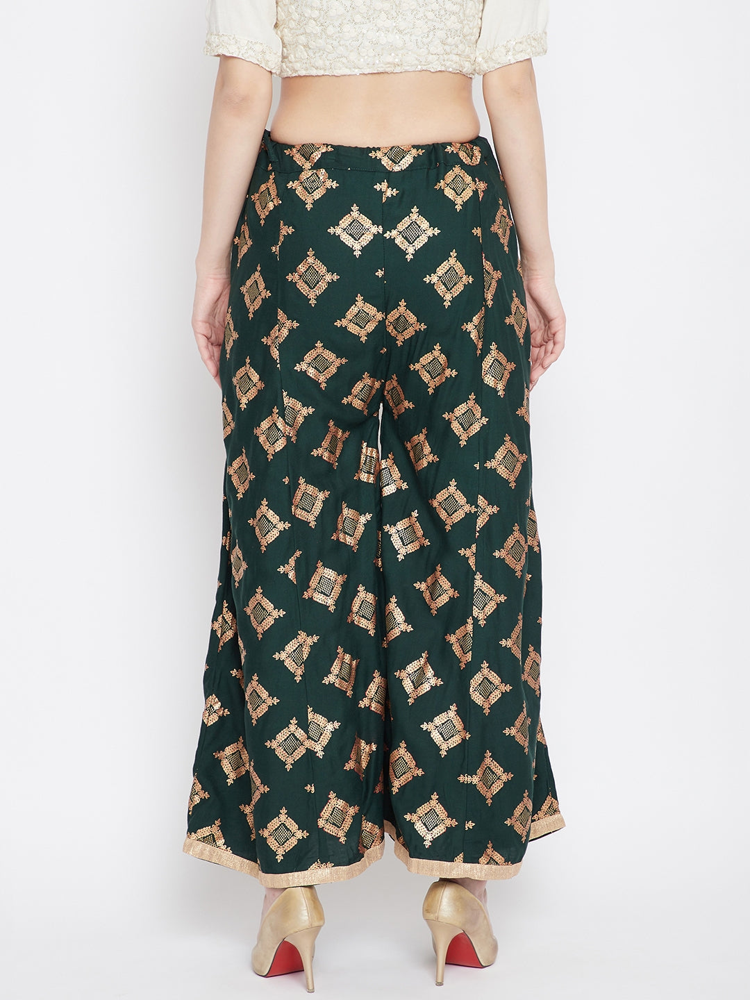 Bottle Green Wide Leg Printed Sharara with gold geometric pattern, worn with heels.