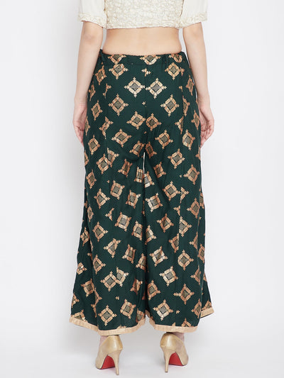 Bottle Green Wide Leg Printed Sharara with gold geometric pattern, worn with heels.