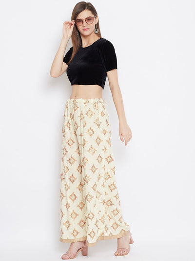 Cream wide leg printed sharara with geometric pattern, paired with a black top.