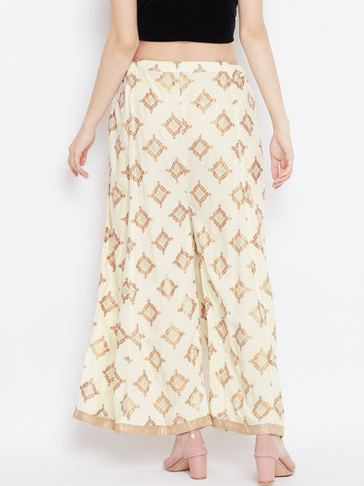 Cream wide leg printed sharara with geometric patterns, styled with heels.