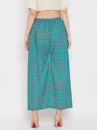Turquoise straight printed palazzo, lightweight rayon, worn by a model.