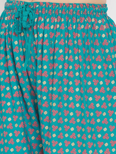 Turquoise straight printed palazzo with floral pattern, lightweight and comfortable rayon fabric.