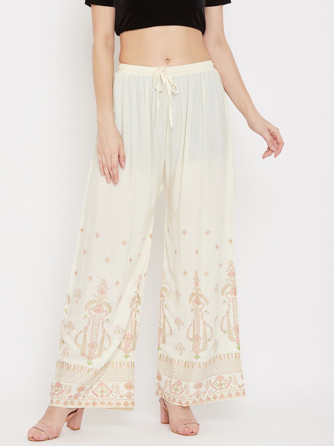 Cream printed rayon palazzo pants with comfortable fit and elegant design.