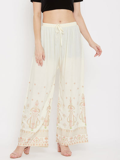 Cream printed rayon palazzo pants with comfortable fit and elegant design.
