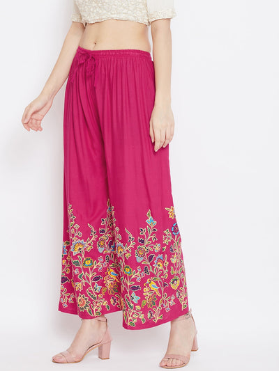 Magenta palazzo with intricate hem design, styled for comfort.