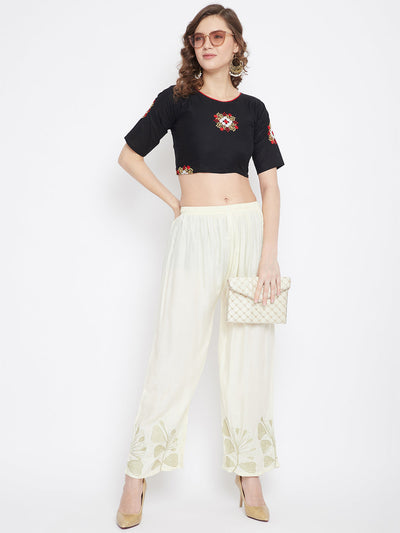 Cream hem design straight palazzo in light fabric worn by a woman.