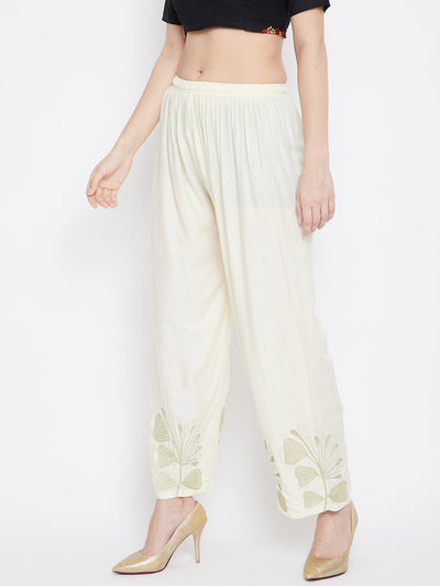 Cream hem design straight palazzo in lightweight rayon.