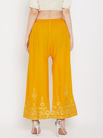 Mustard wide leg hem design palazzo in rayon with decorative hem.