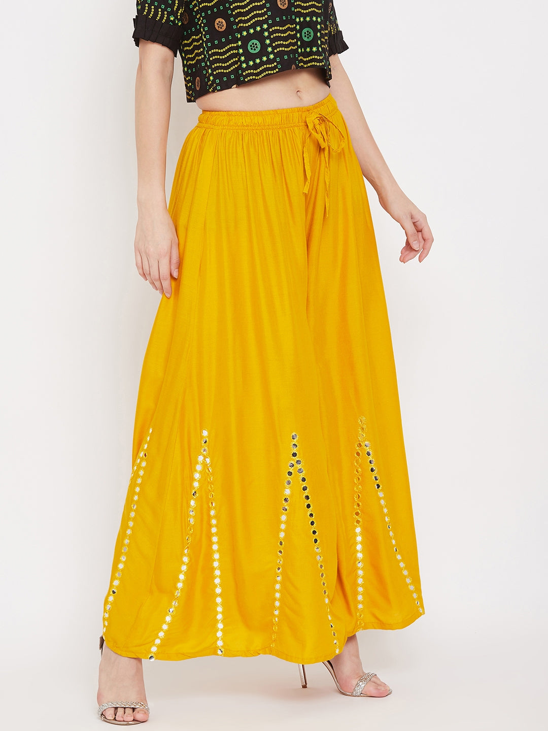 Mustard flared embellished sharara in lightweight rayon fabric.