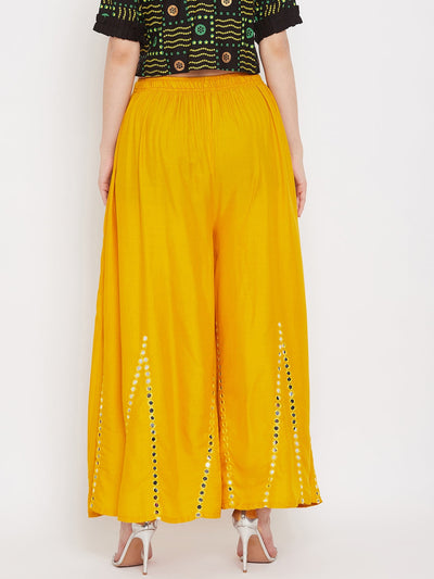 Mustard flared embellished sharara in rayon with intricate design.