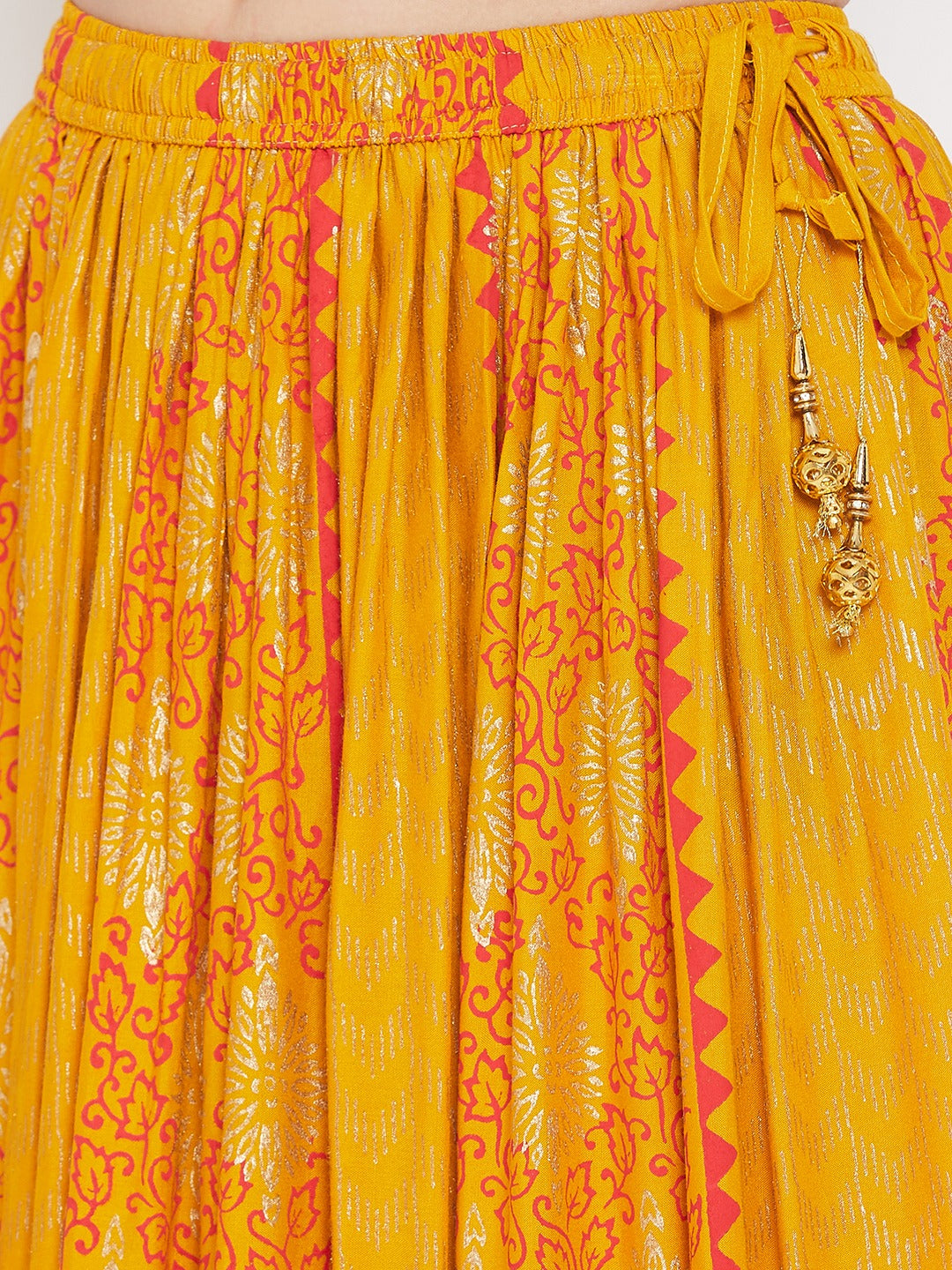 Mustard printed rayon maxi skirt with intricate design.