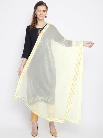 Cream sequinned chiffon dupatta styled with kurta palazzo set.