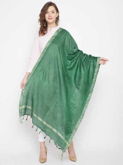 Bottle green solid cotton tussar dupatta styled with a white kurta.