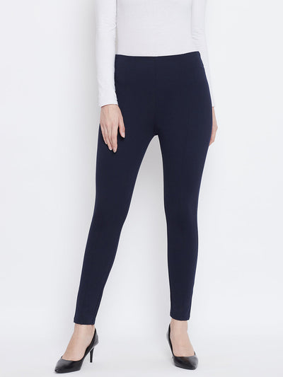 Navy blue regular fit jeggings for women, made from NR Roma fabric, styled with a white top and heels.
