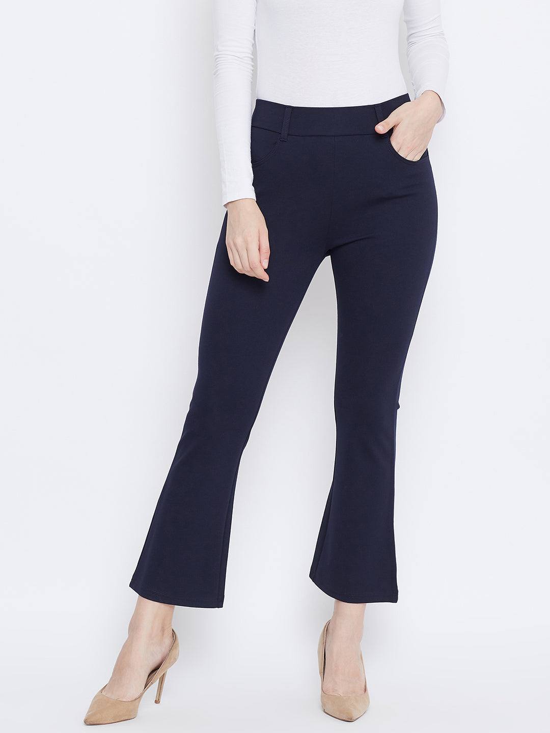 Navy Blue Solid Bootcut Jeggings in NR Roma fabric paired with a white top and heels.