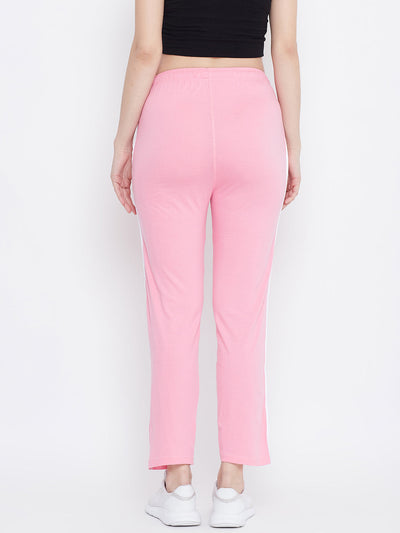 Baby pink straight fit trackpants in hosiery fabric, back view.