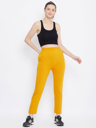 Mustard straight fit trackpants for women, comfortable hosery fabric.