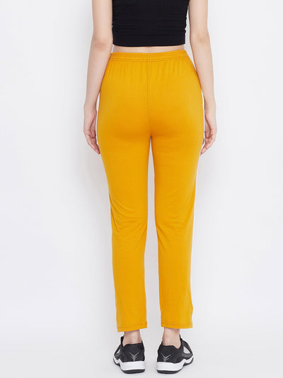 Mustard straight fit trackpants for women made of lightweight hosiery fabric.