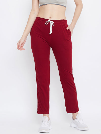 Maroon straight fit trackpants for women in lightweight hosery fabric.