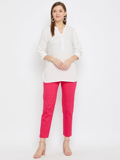 Magenta regular fit solid pants for women in cotton fabric.
