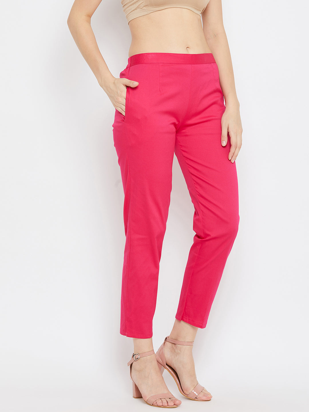 Magenta regular fit solid pants for women made from comfortable cotton fabric.
