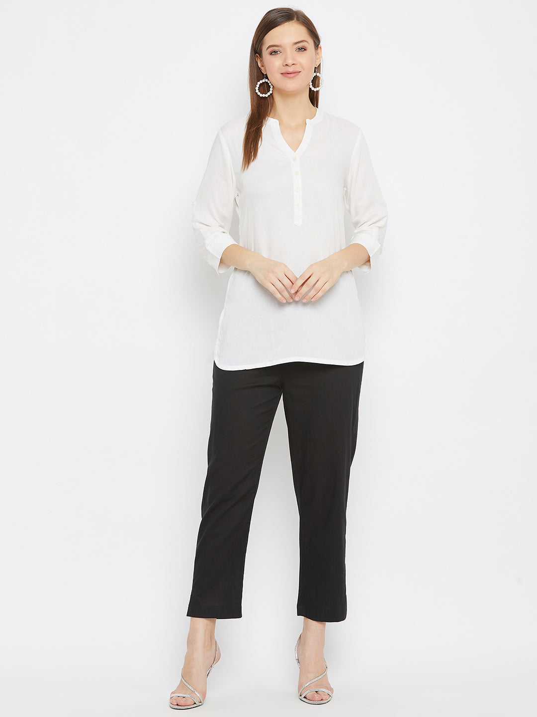 Black regular fit solid pants for women by Baani, lightweight cotton fabric.