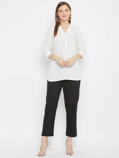 Black regular fit solid pants for women by Baani, lightweight cotton fabric.