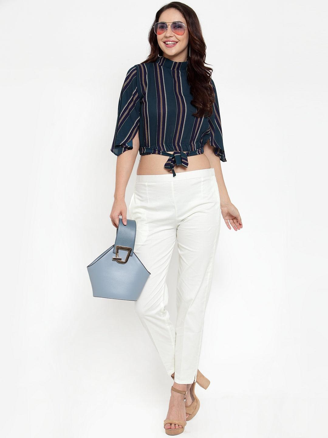 Off-White regular fit solid pants for modern women in cotton fabric.