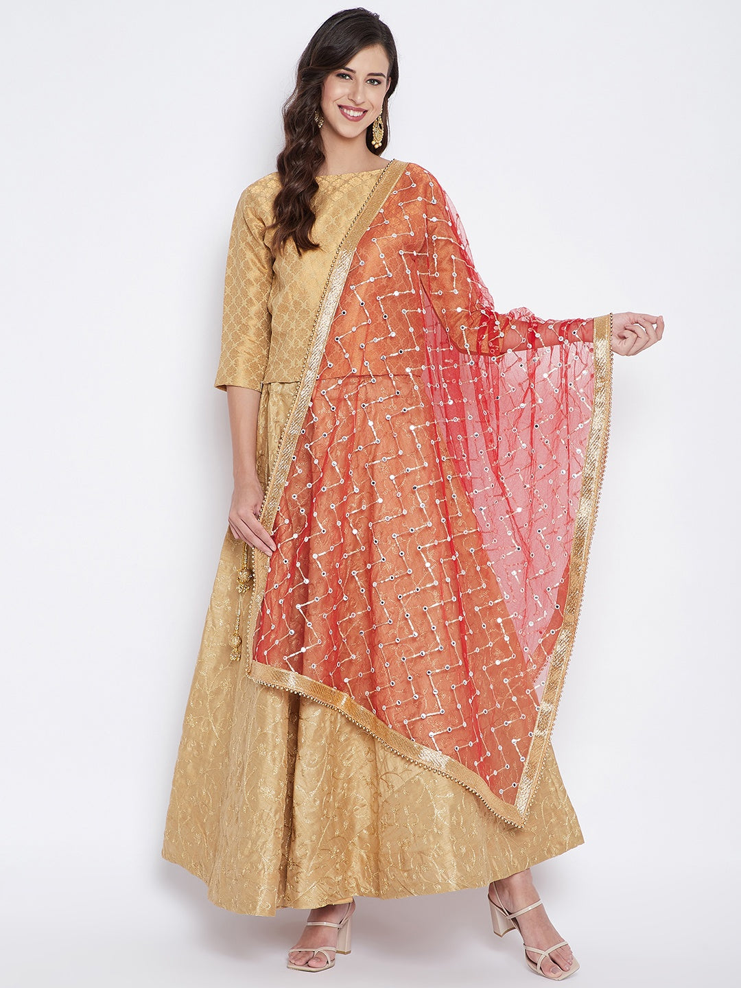 Red Mirror Work Net Dupatta styled with a gold kurta palazzo set.