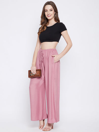 Light Pink Solid Rayon Sharara, comfortable and lightweight, worn with a black crop top.