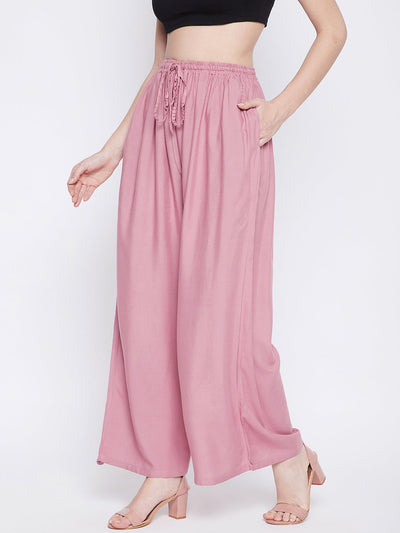Light pink solid rayon sharara with drawstring waist and pockets.