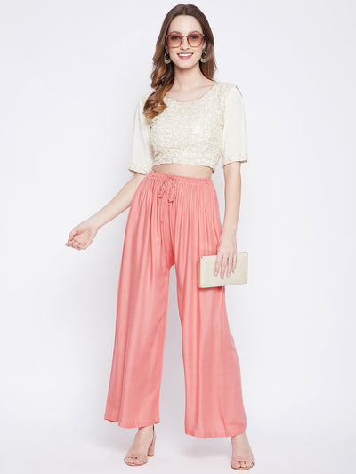Peach solid rayon palazzo, lightweight and comfortable for all-day wear.