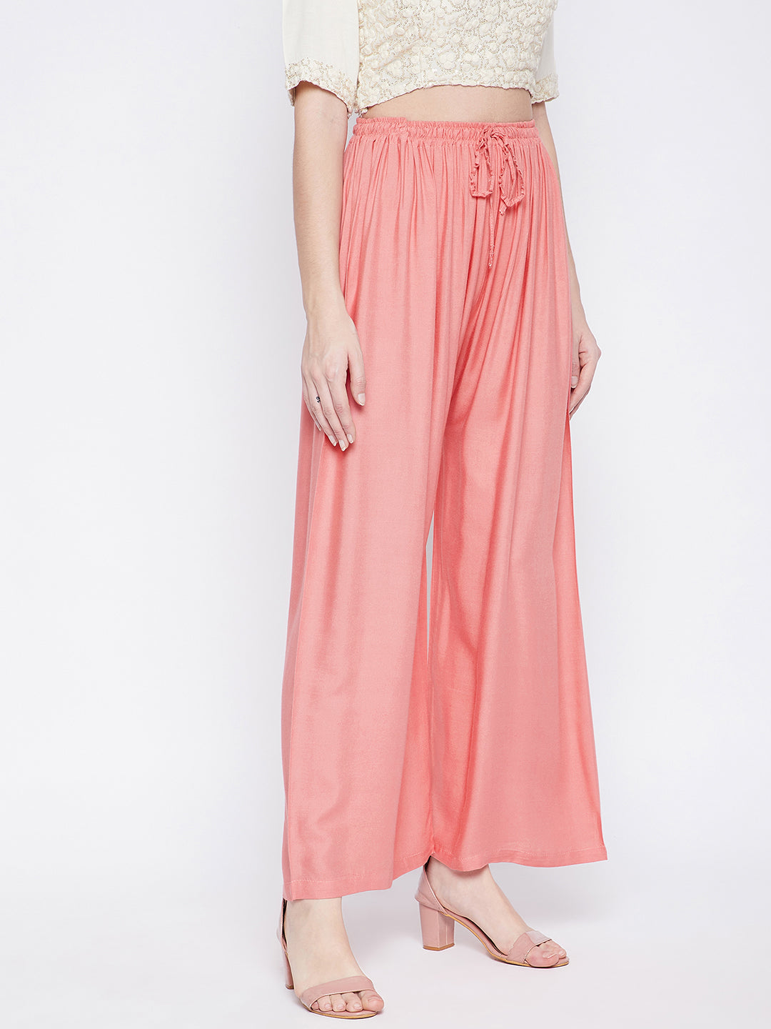 Peach solid rayon palazzo, lightweight and comfortable for all-day wear.