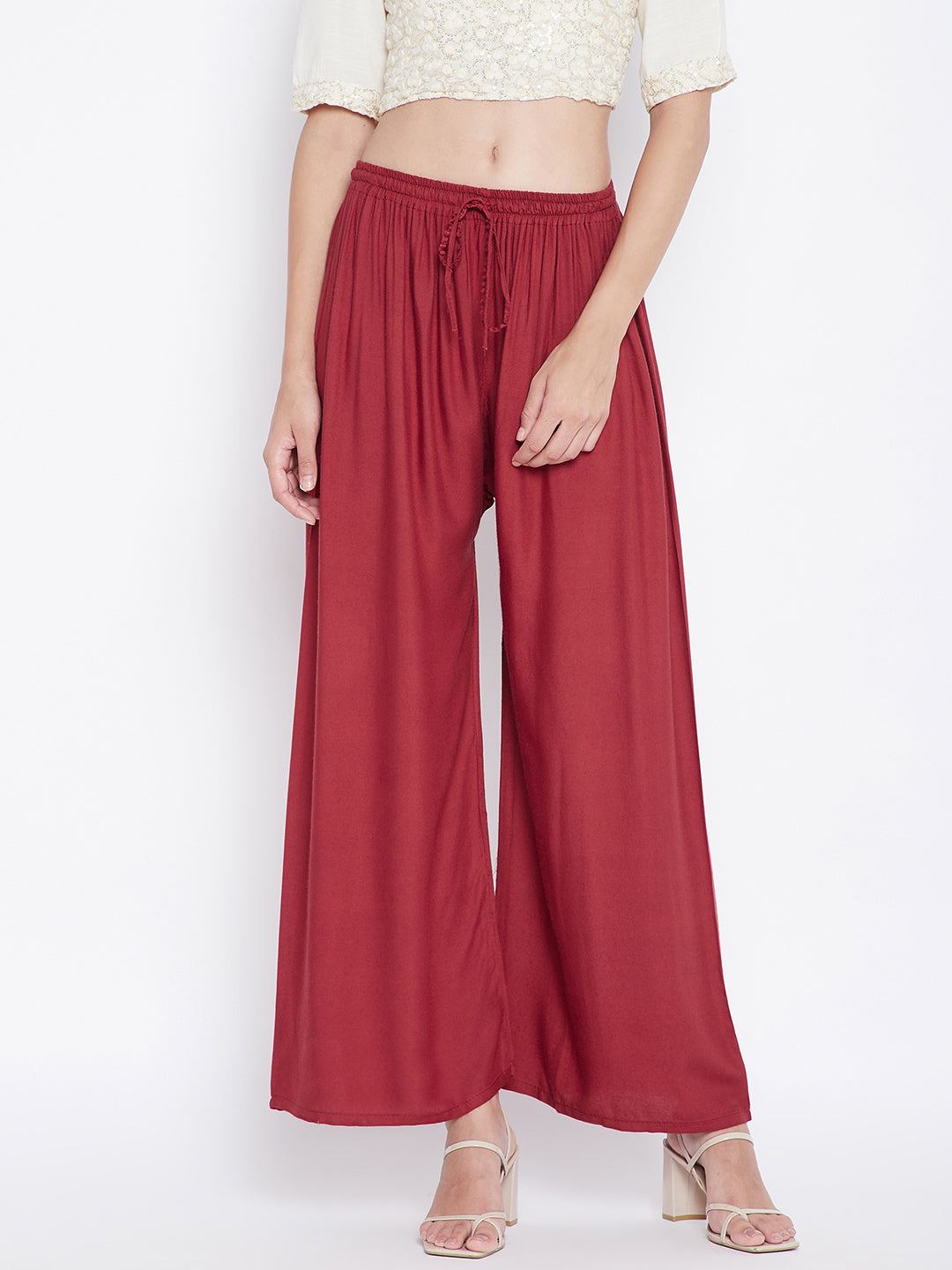 Rust solid rayon palazzo with drawstring and wide legs.