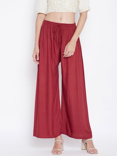 Rust solid rayon palazzo with drawstring and wide legs.