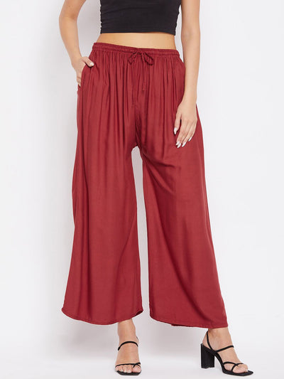 Rust solid rayon sharara pants, comfortable and lightweight, paired with a black top.