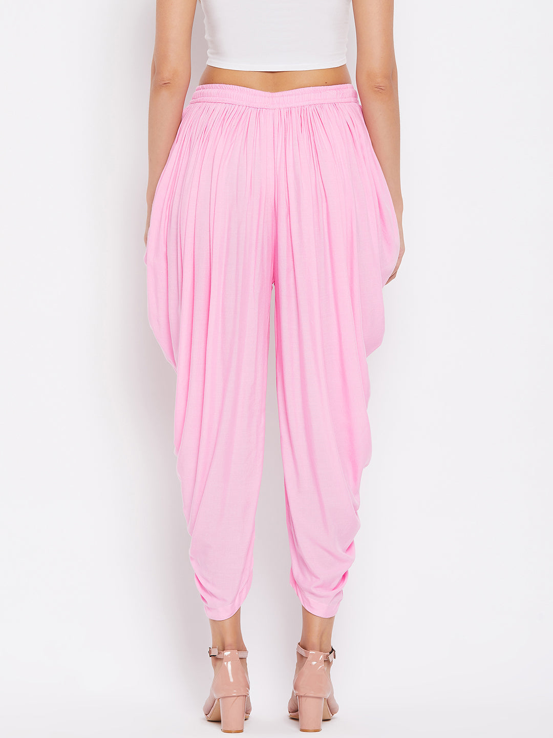 Pink Rayon Dhoti Salwar with elasticated waistband and solid pattern.