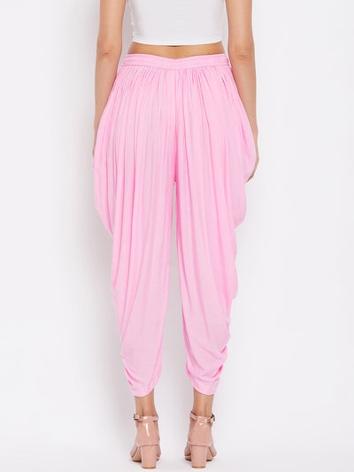 Pink Rayon Dhoti Salwar with elasticated waistband and solid pattern.