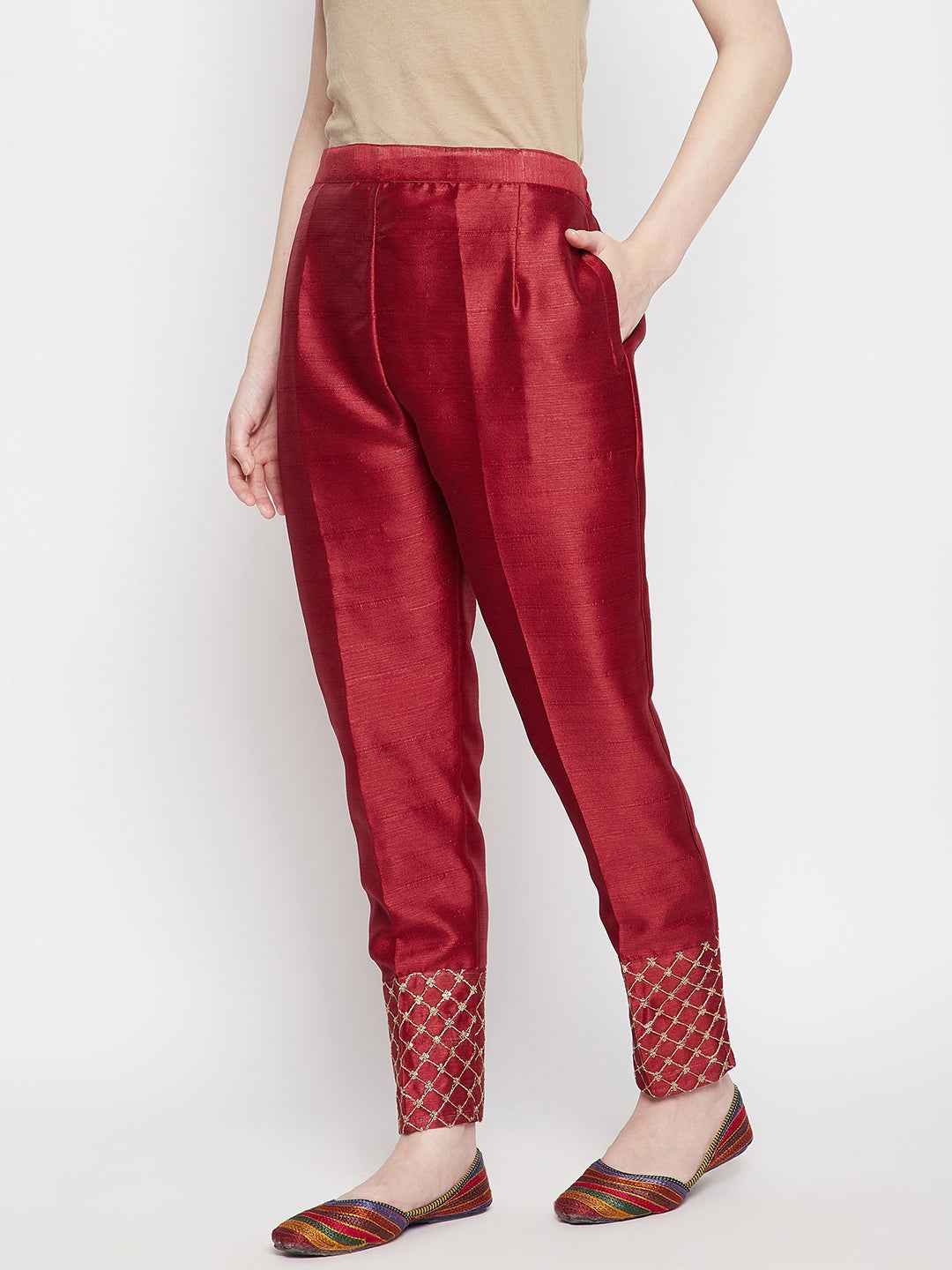 Maroon hem design silk trousers with embellished hem.