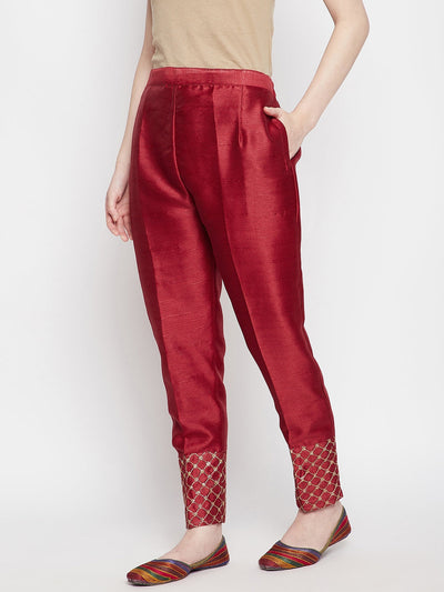 Maroon hem design silk trousers with embellished hem.