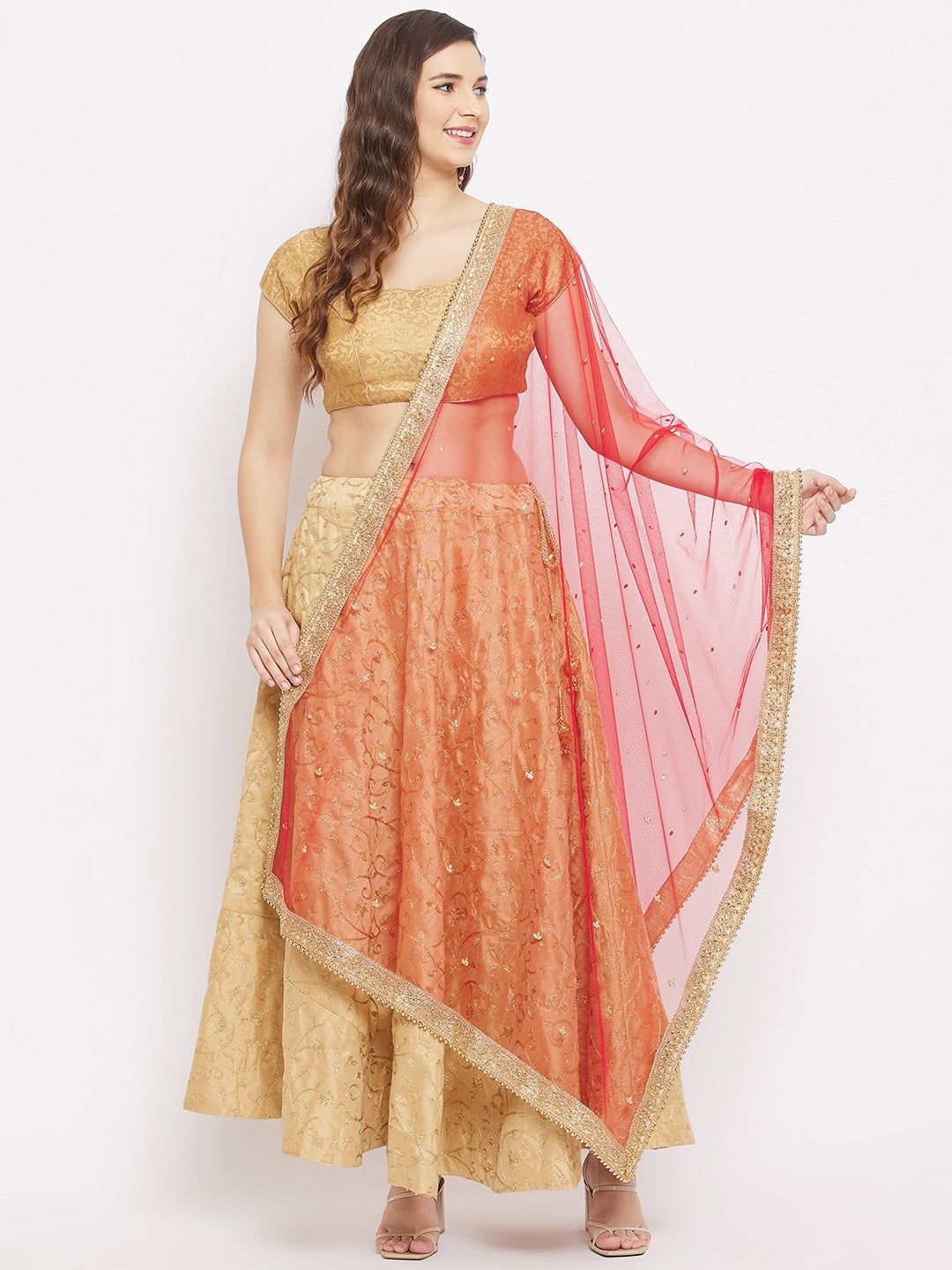 Red embellished dupatta with beads and stones paired with traditional attire.