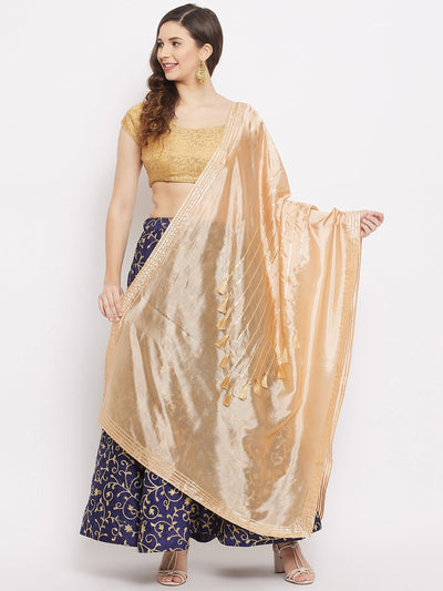 Fawn silk dupatta with gotta patti and tassels work.