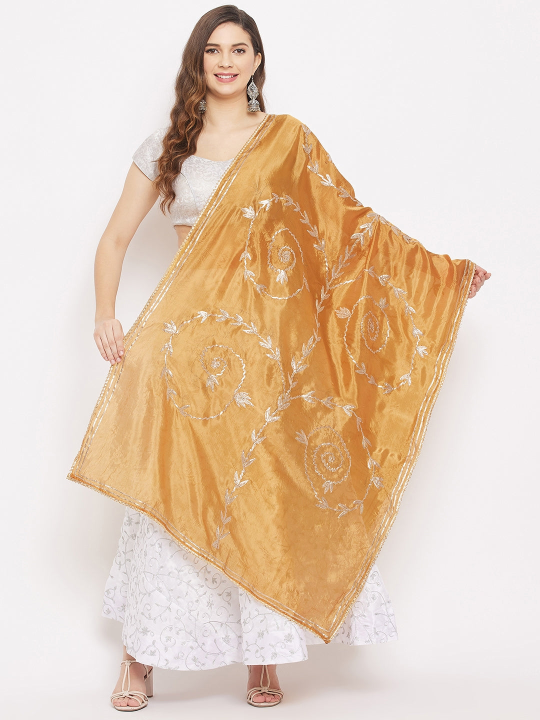 Mustard Gotta Patti Silk Dupatta with intricate design styled with white ethnic outfit.