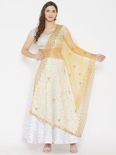 Yellow embroidered net dupatta with sequins, styled with a white outfit.