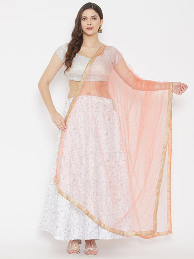 Peach embellished net dupatta styled with traditional attire.