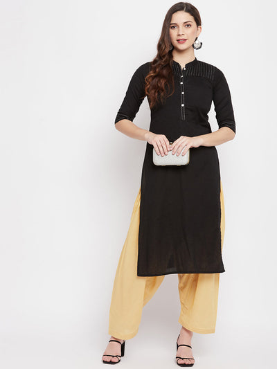 Fawn solid pure cotton salwar paired with black kurta.