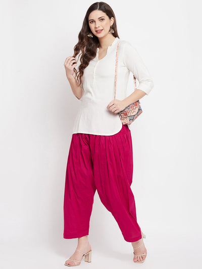 Magenta solid pure cotton salwar paired with white kurta.