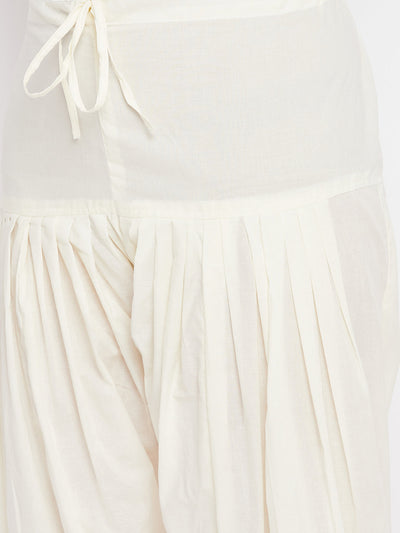 Cream solid pure cotton salwar with pleated design.