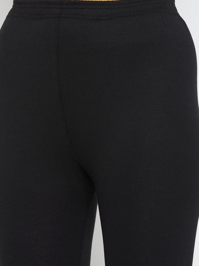 Black solid ankle length leggings in cotton lycra.